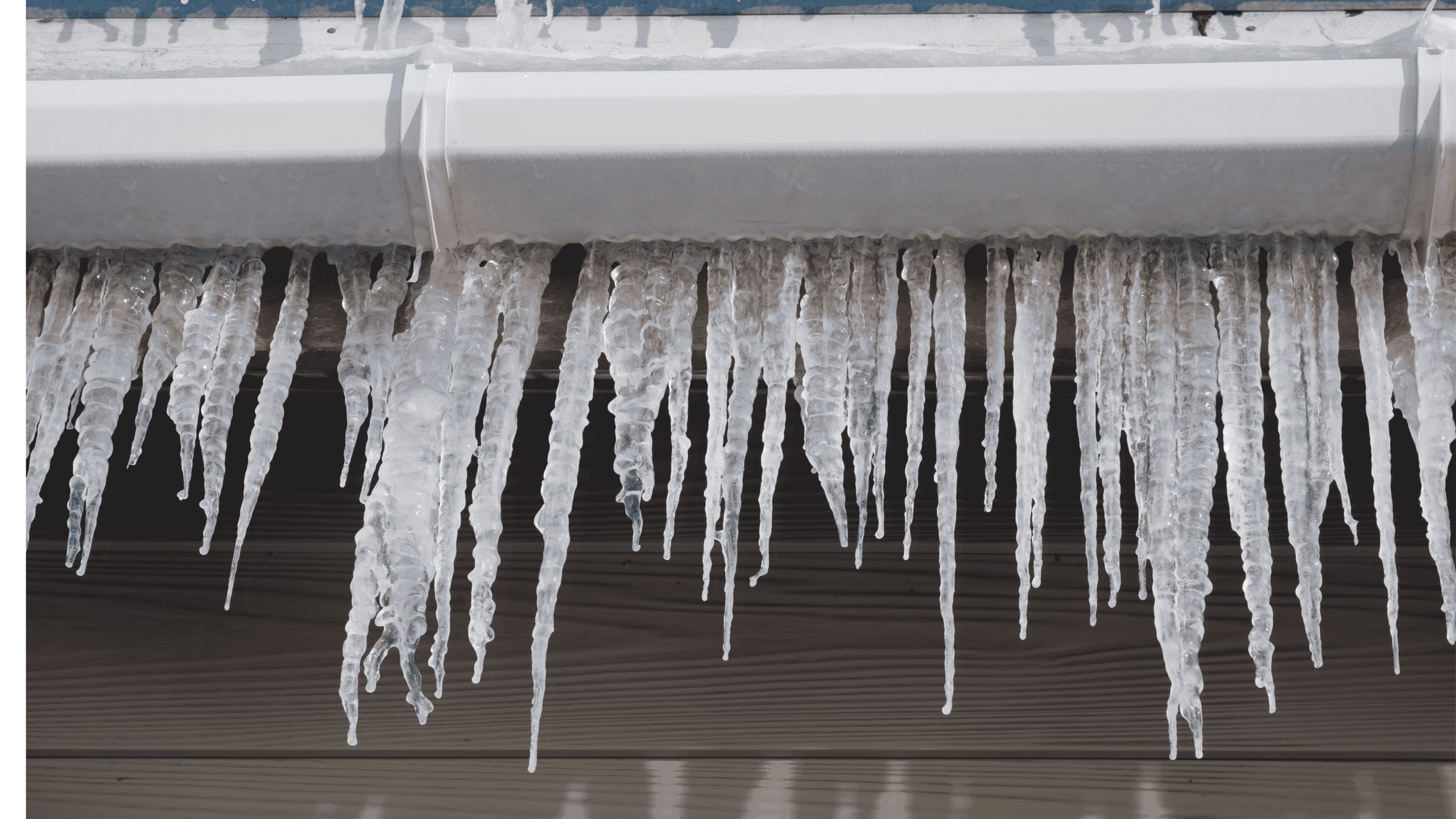 frozen gutters with icicles